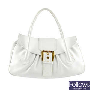 CELINE - a large white leather handbag.