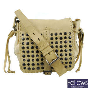 PRADA - a beige Studded Tessuto nylon messenger handbag.