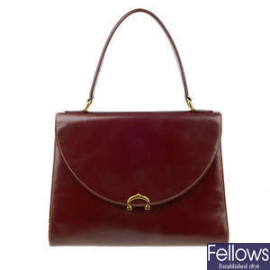 CARTIER - a Must Line Bordeaux leather handbag.