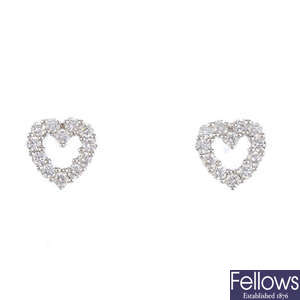 A pair of 18ct gold diamond heart ear studs.