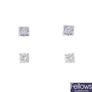 Two pairs of brilliant-cut diamond stud earrings.