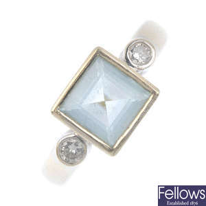An 18ct gold aquamarine and diamond three-stone ring.
