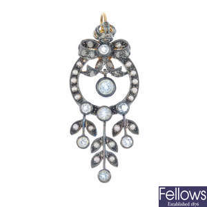 A topaz, seed pearl and diamond pendant.