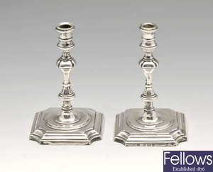 A pair of Edwardian silver mounted tapersticks.