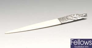 A foreign silver handled ivory letter opener.