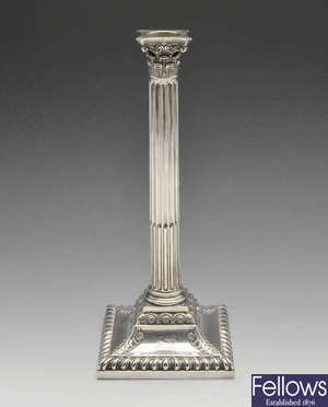 A late Victorian silver mounted candlestick.