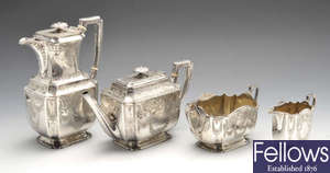 A late Victorian and Edwardian four-piece silver tea service, plus a similar silver plated spirit kettle.