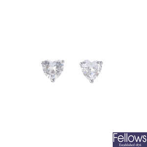 A pair of 18ct gold heart-shape diamond stud earrings.