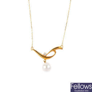 MIKIMOTO - a cultured pearl and diamond pendant.