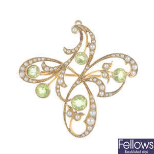 An early 20th century gold peridot and split pearl floral brooch.