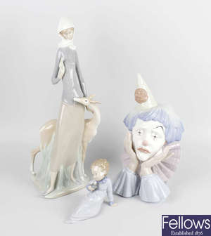 A group of four Lladro figurines.