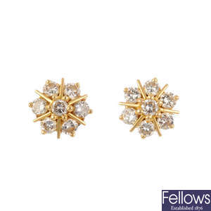 A pair of diamond cluster stud earrings.