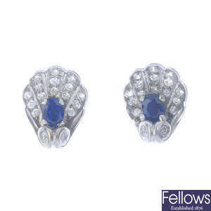A pair of sapphire and diamond shell stud earrings.