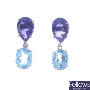A pair of amethyst and topaz earrings.