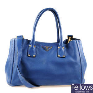 PRADA - a blue leather tote handbag.