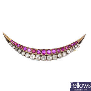 A late Victorian silver and gold, ruby and diamond crescent brooch.