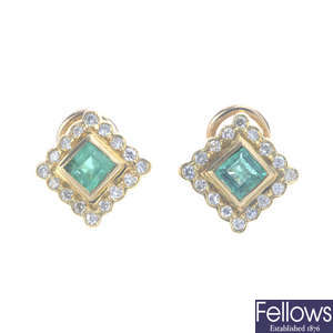 A pair of emerald and diamond cluster stud earrings.