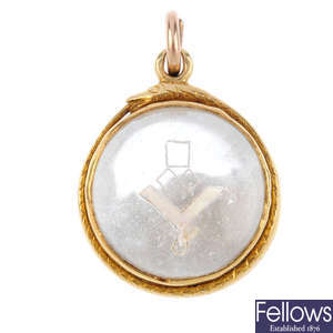 A late 19th century gold Masonic rock crystal ouroboros pendant.