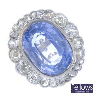 A Ceylon sapphire and diamond cluster ring.