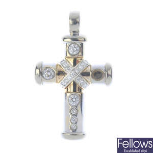 A diamond cross pendant.