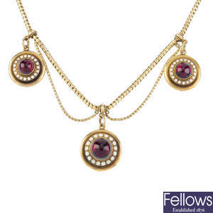 A late Victorian gold, garnet and enamel necklace.