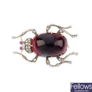 A late Victorian silver and gold diamond and gem-set Scarab brooch.