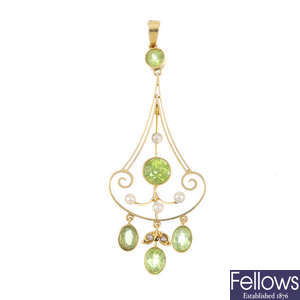 An early 20th century 15ct gold peridot and seed pearl pendant.
