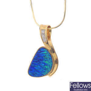 A boulder opal and diamond pendant, with chain.
