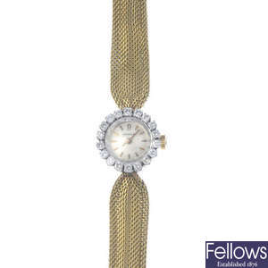 OMEGA - a lady's mid 20th century 18ct gold diamond cocktail watch.