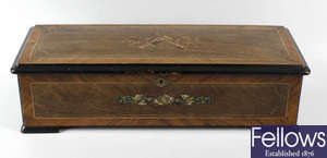 A rosewood cylinder musical box.