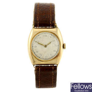 ROLEX - a yellow metal mid-size wrist watch.
