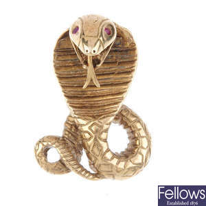 A 9ct gold synthetic ruby snake pendant.
