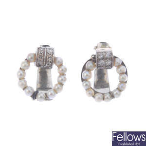A pair of diamond and seed pearl clip earrings.
