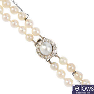 A cultured pearl two-row necklace, with pearl and diamond cluster clasp.