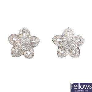 A pair of diamond floral cluster earrings.