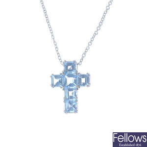 An 18ct gold topaz cross pendant, with chain.