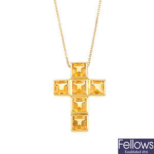 A citrine cross pendant, with chain.