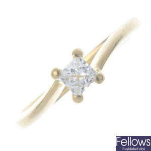 An 18ct gold diamond single-stone ring and a fitted band ring.