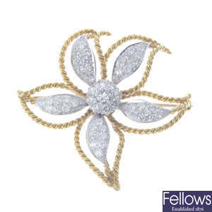 A diamond flower brooch.