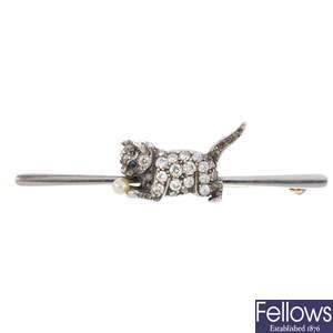 An early 20th century 15ct gold and silver diamond cat bar brooch.