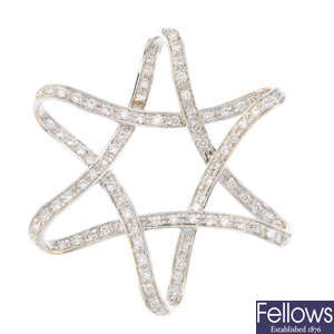 A diamond star pendant.