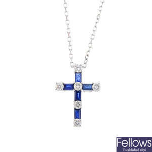 A sapphire and diamond cross pendant, on chain.