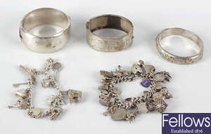 A small selection of various silver and other bracelets.