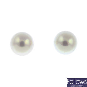 A pair of cultured pearl stud earrings.