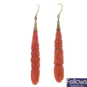 A pair of late 19th century gold carved coral earrings.