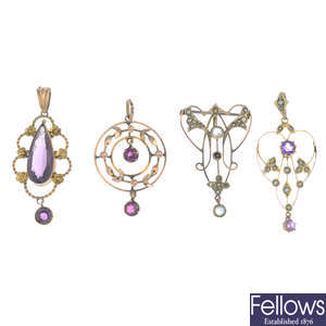 Four early 20th century gold gem-set pendants.