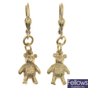 A pair of teddy bear earrings.