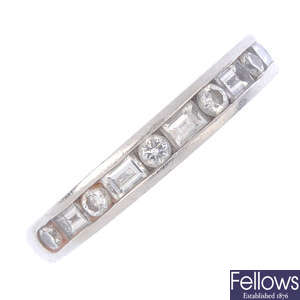 TIFFANY & CO. - a platinum diamond half-eternity ring.