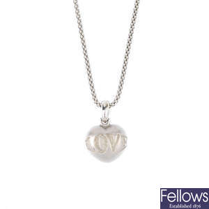 An 18ct gold heart-shape pendant, with chain.