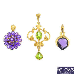 Five gem-set pendants.